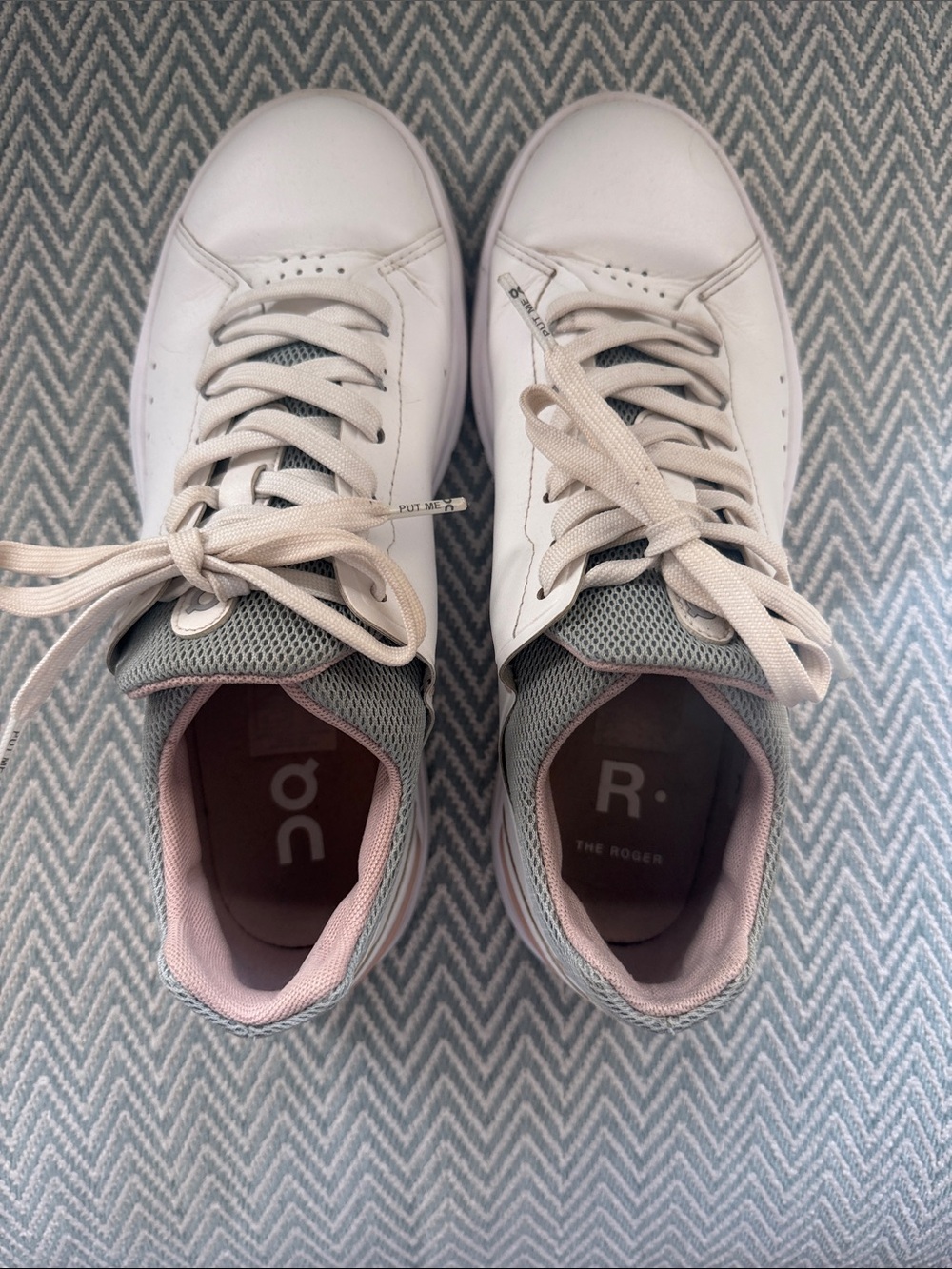 On Running Women's White Sneakers with Light Pink Lining and green trim.